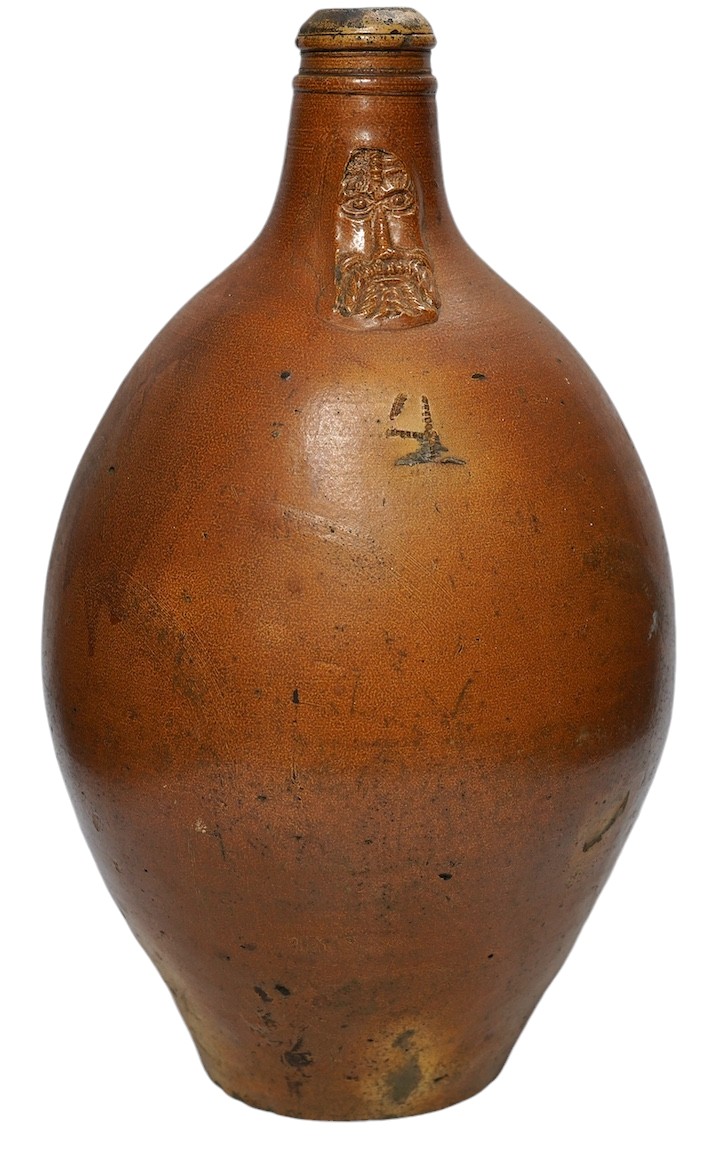 An 18th century German large salt glazed Bellarmine, 45cm. Condition - commensurate with age